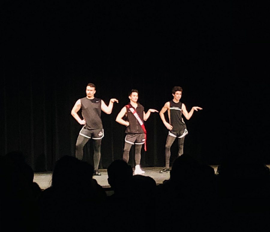Cole Guinther, junior, (center) does Beyonces Single Ladies dance routine with Michael Kellog, senior, (left) and Casey Tallungan, junior (right).