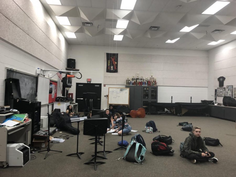 Students in the band room hang out and work on their music.