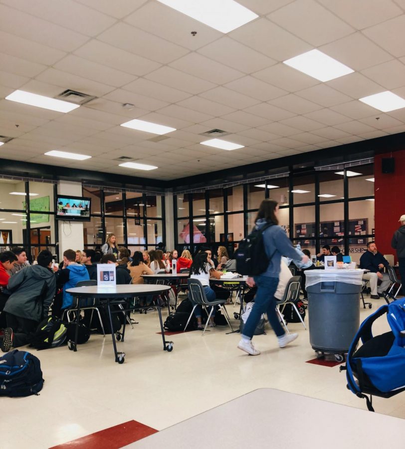 Students enjoy their lunch in the busy cafeteria during third block lunch.