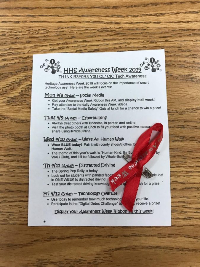 Heritage kicks off Awareness Week by handing out Awareness Ribbons and the schedule for the week.