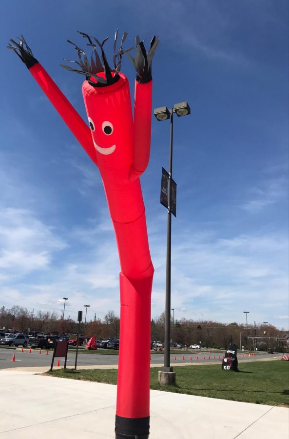 Tube Man welcomes students to the stadium after the walk.