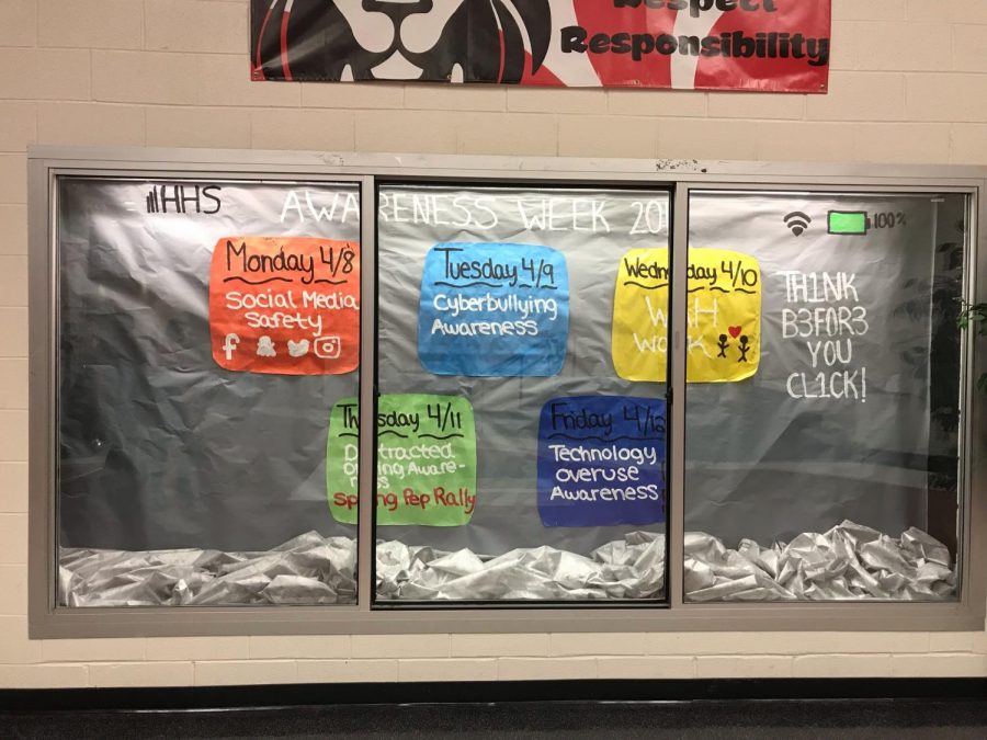 The display case outside the main office is decorated for Awareness Week to remind students of what to expect.