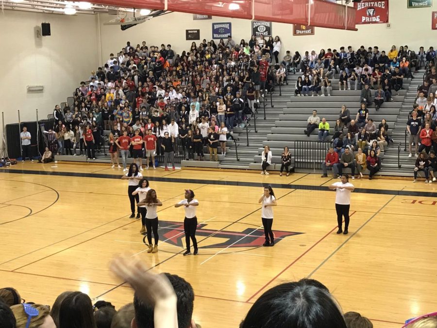 The Heritage step team performing for the school during the pep rally.