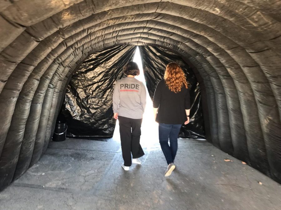 Mrs. Cloud and Ms. Vrable walking through the blowup tunnel to the stadium where the Awareness Walk concluded.