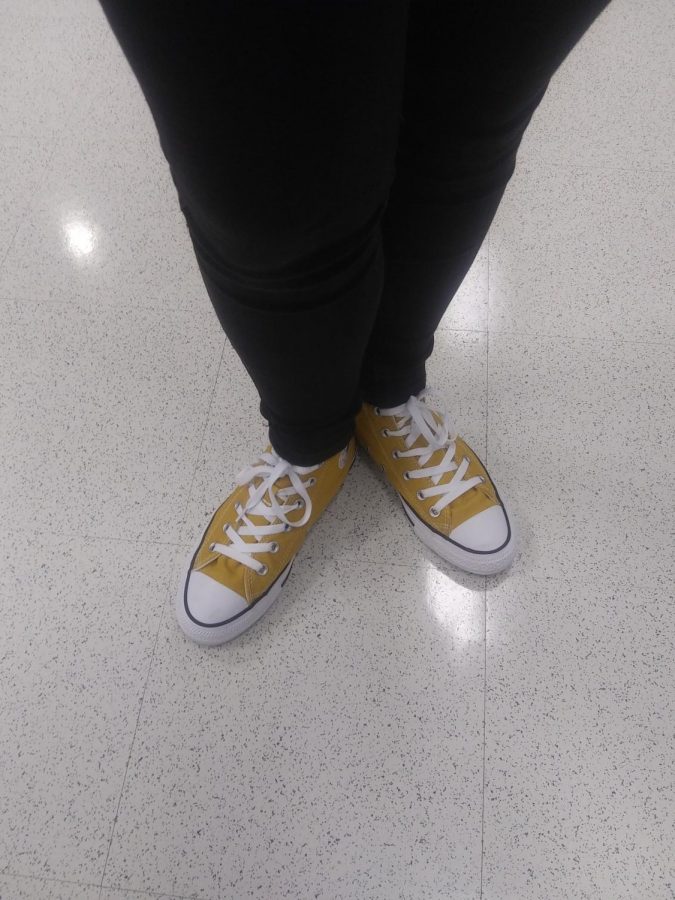 Nicole loves the color yellow. She has multiple yellow shirts and these yellow shoes!