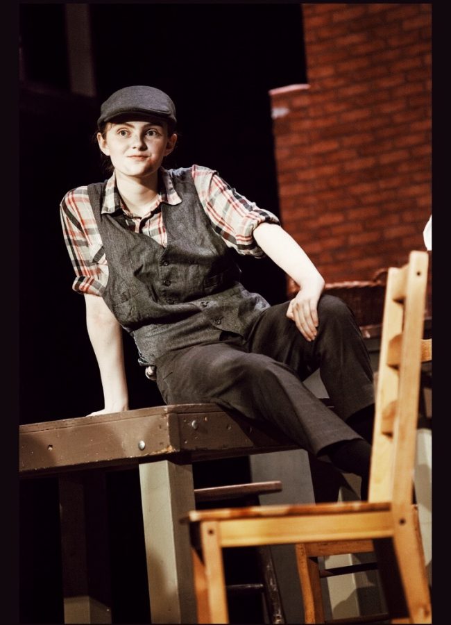 Sam enjoys and is very invested in theatre. So far, her favorite role has been Twitch in Newsies.