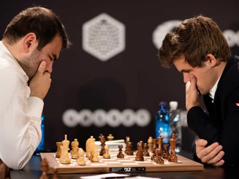 World chess champion Magnes Carlsen (right) wont play his computer or play the game like a computer. Instead, he chooses his strategy based on what he knows about his opponent